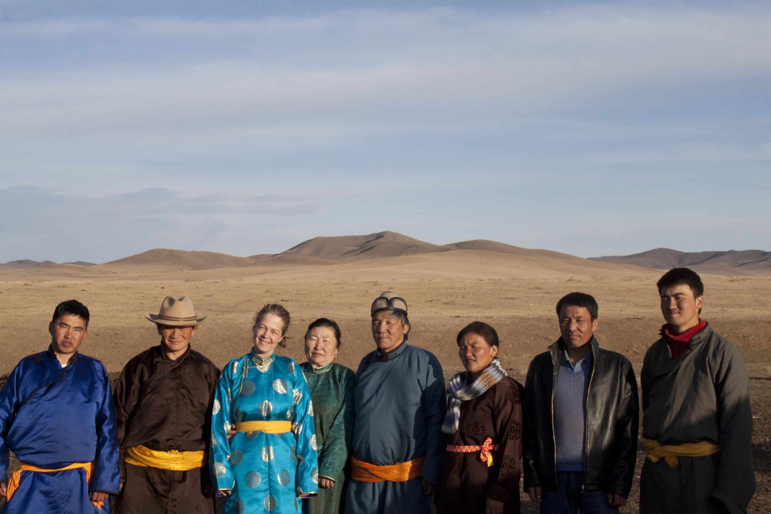 A volunteer takes a group photo with her host family in Mongolia during her cultural exchange program.