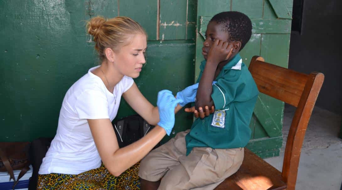 Student doctor learning new skills in Ghana