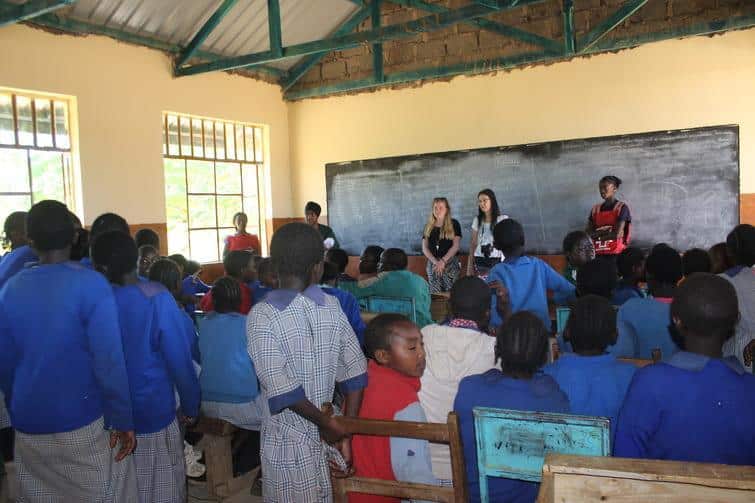 Volunteers in Kenya lead a health presentation