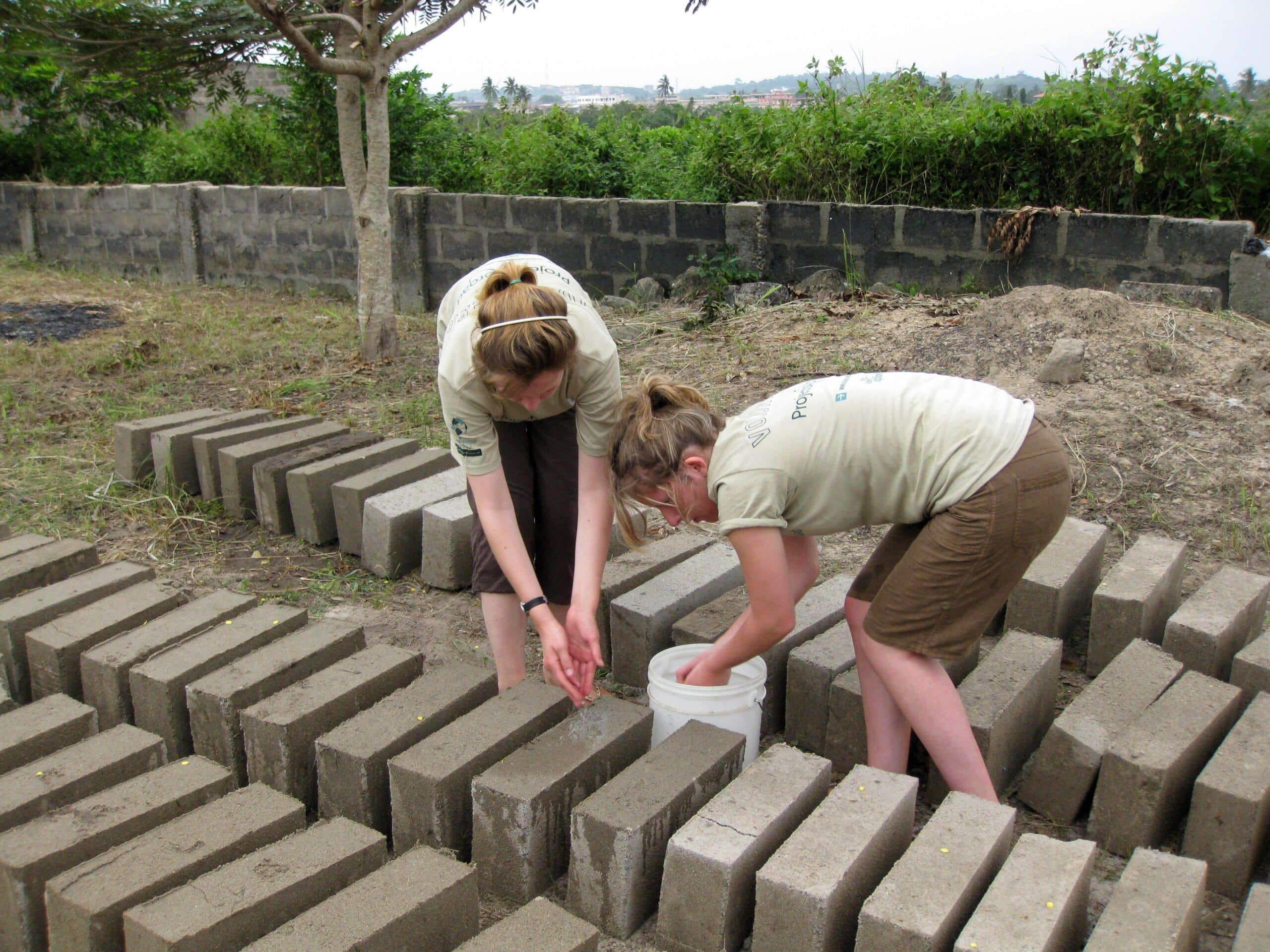 An important part of building volunteer work in Ghana is to prepare building materials.