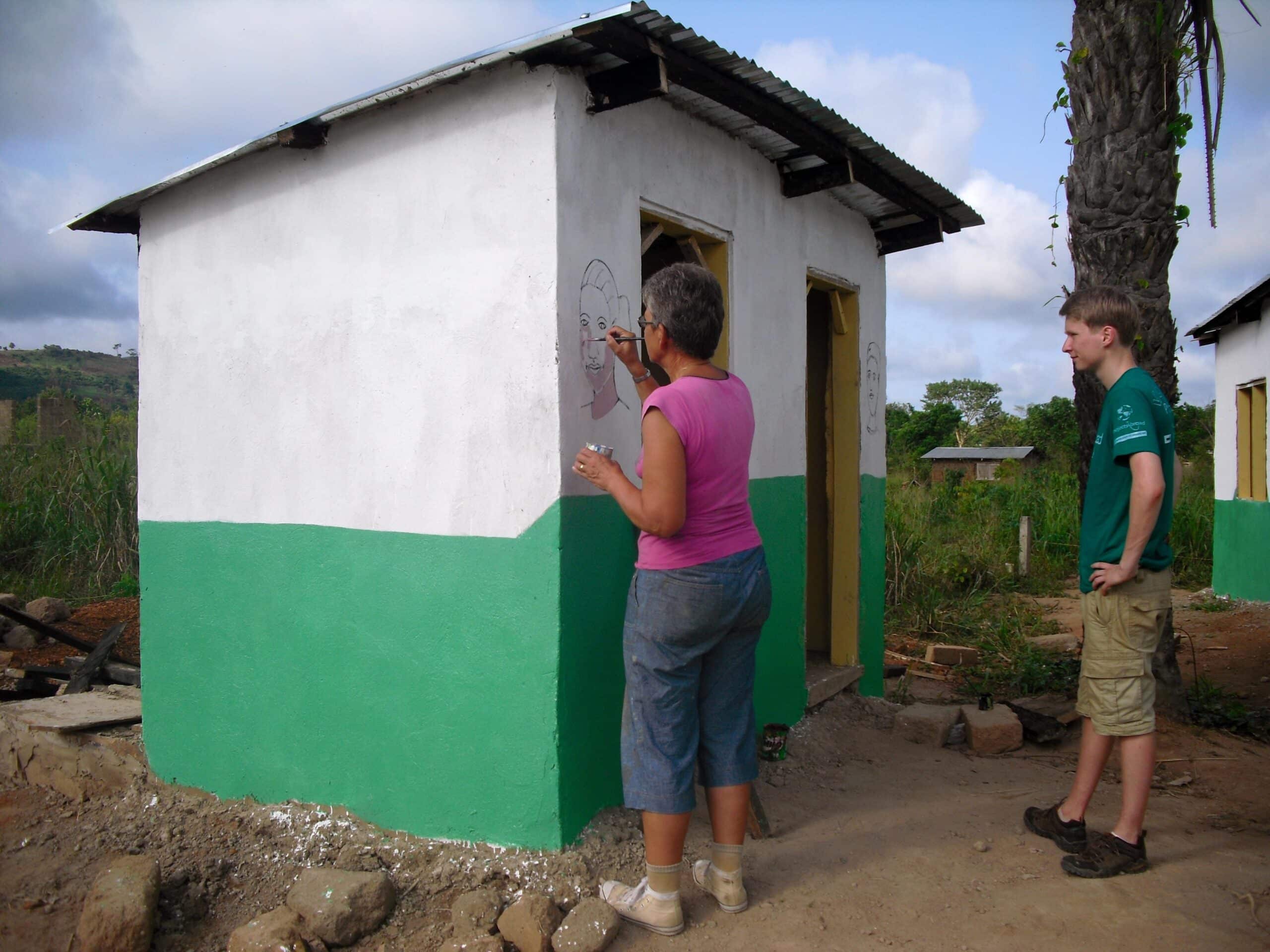 Painting fun and educational murals is part of building volunteer work in Ghana.