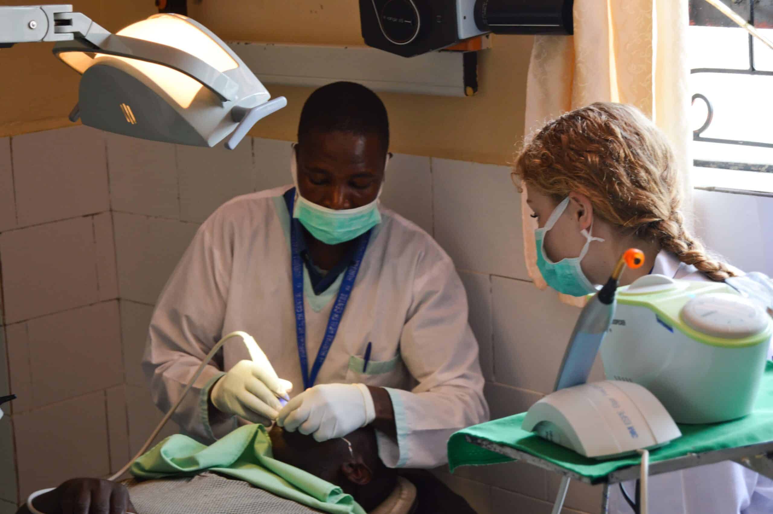 A teenage volunteer doing a medical internship with Projects Abroad in Kenya shadows a medical professional.